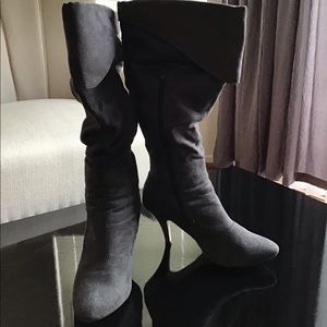 Anne Michelle Gray knee high heel boots.